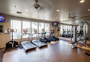 Phoenix apartment for rent - a gym with cardio equipment and windows in a building