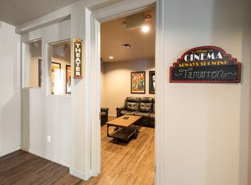 Phoenix apartment for rent - a corridor with a living room with a couch and a table