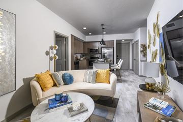 West Palm Beach apartment for rent - A modern living room with a white sofa and a coffee table.
