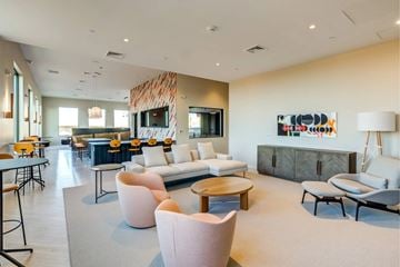 Weymouth apartment for rent - A modern living room with a large painting on the wall.
