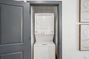 Mesa apartment for rent - A white toilet is installed in a small space between a door and a wall.
