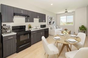 Phoenix apartment for rent - A modern kitchen with a dining table set for two.