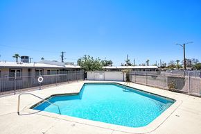 Phoenix apartment for rent - A small pool with a fence around it.