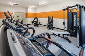 Phoenix apartment for rent - A gym with treadmills, weights and exercise machines.