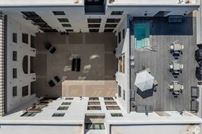 Tucson apartment for rent - A modern house with a central courtyard and a pool.