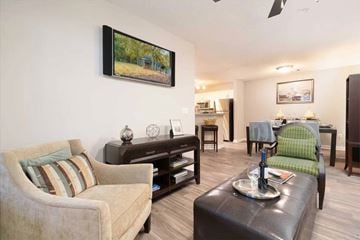 Marietta apartment for rent - A living room with a couch, a chair, a coffee table, and a painting on the wall.
