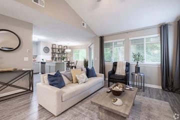 Hilton Head Island apartment for rent - A modern living room with a white sofa and a coffee table.