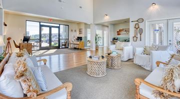 Corpus Christi apartment for rent - A living room with a white couch and a grey rug.