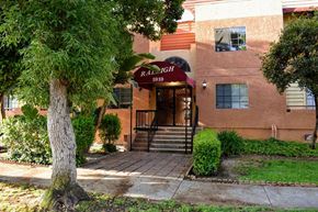 Glendale apartment for rent - A building with a red sign that says "Raleigh" on it.
