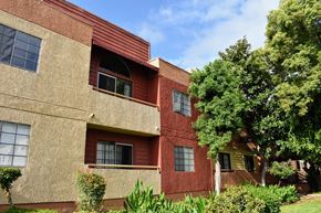 Glendale apartment for rent - A red building with a balcony and a window.