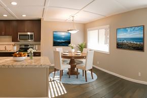 Sacramento apartment for rent - A modern kitchen with a dining table and chairs.