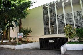 Los Angeles apartment for rent - a building with a gate and a tree in front of it