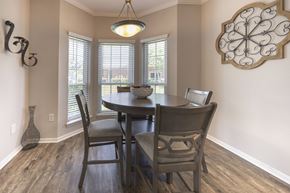 Pearland apartment for rent - A dining room with a table and chairs.