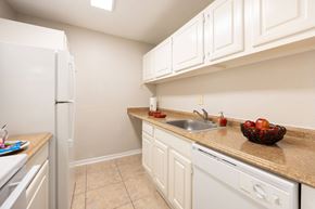 Stafford apartment for rent - A kitchen with white cabinets and appliances.
