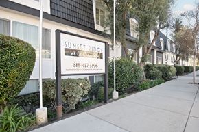 La Crescenta apartment for rent - A sign for Sunset Ridge at La Crescent is displayed in front of a building.