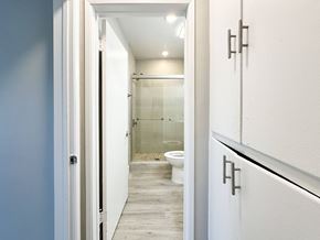 West Hollywood apartment for rent - A white door is open to a bathroom with a toilet and a walk-in shower.