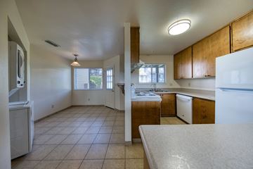 Shingle Springs apartment for rent - A kitchen with white appliances and wooden cabinets.