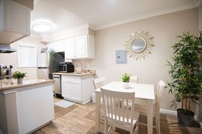 Torrance apartment for rent - A kitchen with white cabinets and a countertop with a sink.