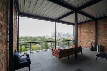 Houston apartment for rent - a living room with a couch and a view of the city