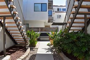 Hermosa Beach apartment for rent - walkway between units with colorful foliage