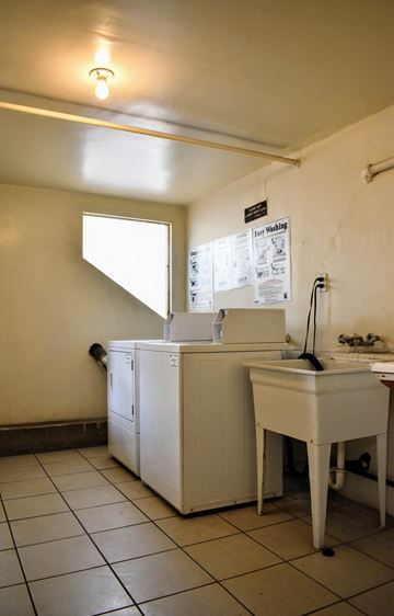 Los Angeles apartment for rent - an empty kitchen with a sink and a washing machine