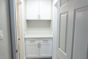 Hollywood apartment for rent - a white kitchen with white cabinets and white drawers