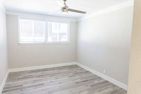Hollywood apartment for rent - an empty room with wood floors and a window