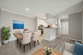 Frisco apartment for rent - A dining room with a wooden table and chairs.