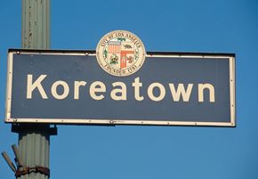 Los Angeles apartment for rent - A street sign for Koreatown with a seal on it.