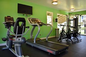 Lompoc apartment for rent - community fitness center with stationary bikes, treadmill, and weight machines