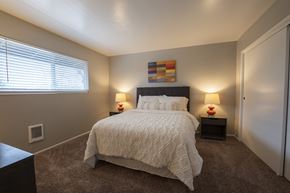 Lompoc apartment for rent - View of furnished model bedroom with carpet flooring and well lit window