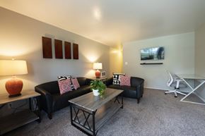 Lompoc apartment for rent - View of furnished model living room with carpet flooring and furniture