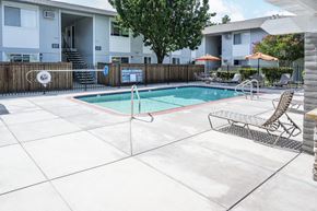 Tracy apartment for rent - our apartments have a swimming pool and a patio with chairs