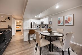 Tyler apartment for rent - A modern kitchen with a dining table set for two.