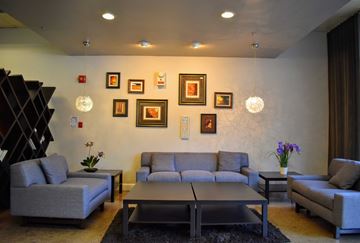 Los Angeles apartment for rent - a living room with couches and pictures on the wall