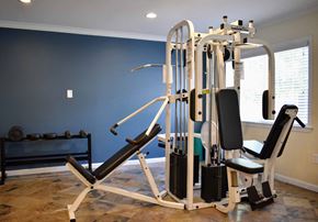 Torrance apartment for rent - View of community gym with free weights, weight machine, and well lit window