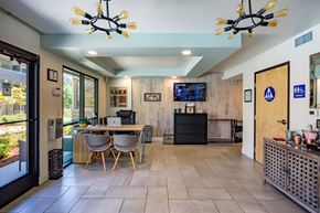 Carmichael apartment for rent - a dining room with a table and chairs and a tv