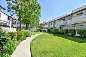 Simi Valley apartment for rent - A residential area with apartment buildings and a well-maintained lawn.