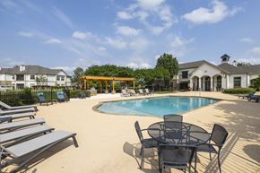 Bossier City apartment for rent - our apartments offer a swimming pool with chairs and tables