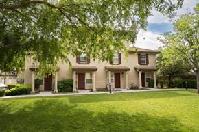 Tracy apartment for rent - building at Tuscana with a lawn and trees in front of it