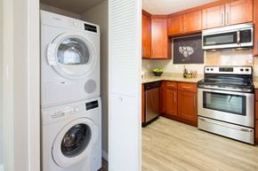 Carmichael apartment for rent - a kitchen with a washing machine and a dishwasher in it