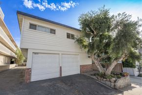 Hermosa Beach apartment for rent - A house with a tree in front of it.