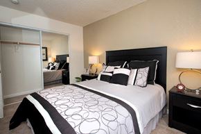 Tracy apartment for rent - View of bedroom with sliding glass mirror closet with ample space to hang clothers, carpet flooring, and furnished as a model