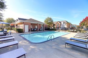 Bossier City apartment for rent - View of gated pool area with ample lounge chairs and sitting areas