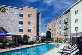 Richardson apartment for rent - our apartments have a large pool and lounge chairs at Parks Residential - Richardson, Richardson, 75082