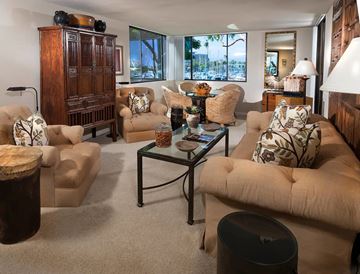 Marina Del Rey apartment for rent - A living room with a glass coffee table and a large window.