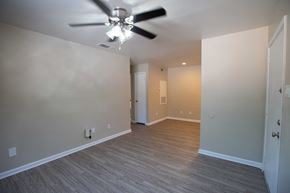 Huntsville apartment for rent - Rolling Brook Living Room with wood look flooring and ceiling fan