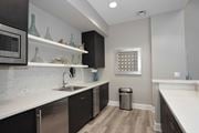Roseville apartment for rent - a kitchen with a sink and a microwave