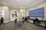 Roseville apartment for rent - a conference room with a desk and chairs and a table