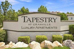 Prescott Valley apartment for rent - A sign for Tapestry at Granville Luxury Apartments is displayed in front of a building.